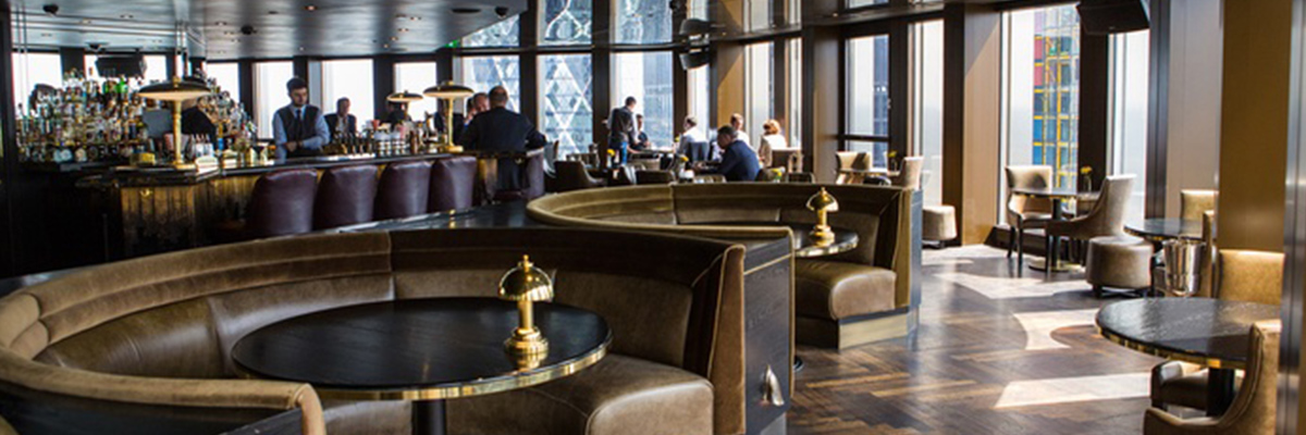 A bar inside City Social London featuring Q-SYS speakers