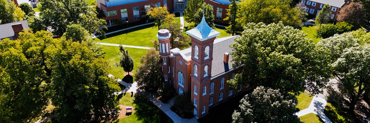 Aerial shot of the Illinois College campus with the center focus being an old rustic-style brick building
