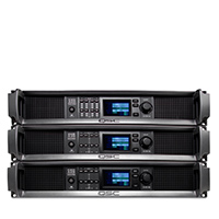 Three QSC CDX-Q Amplifiers stacked on top of each other