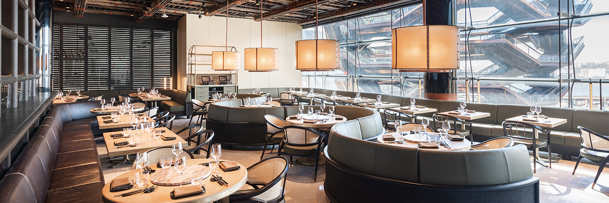 View inside of Wild Ink Restaurant and Bar with empty tables all set neatly for customers